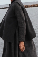 Flared sleeveless jacket, grey wool with raw edges