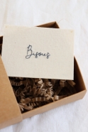 Embroided words "Bisous"