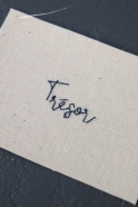 Embroided words "Trésor"