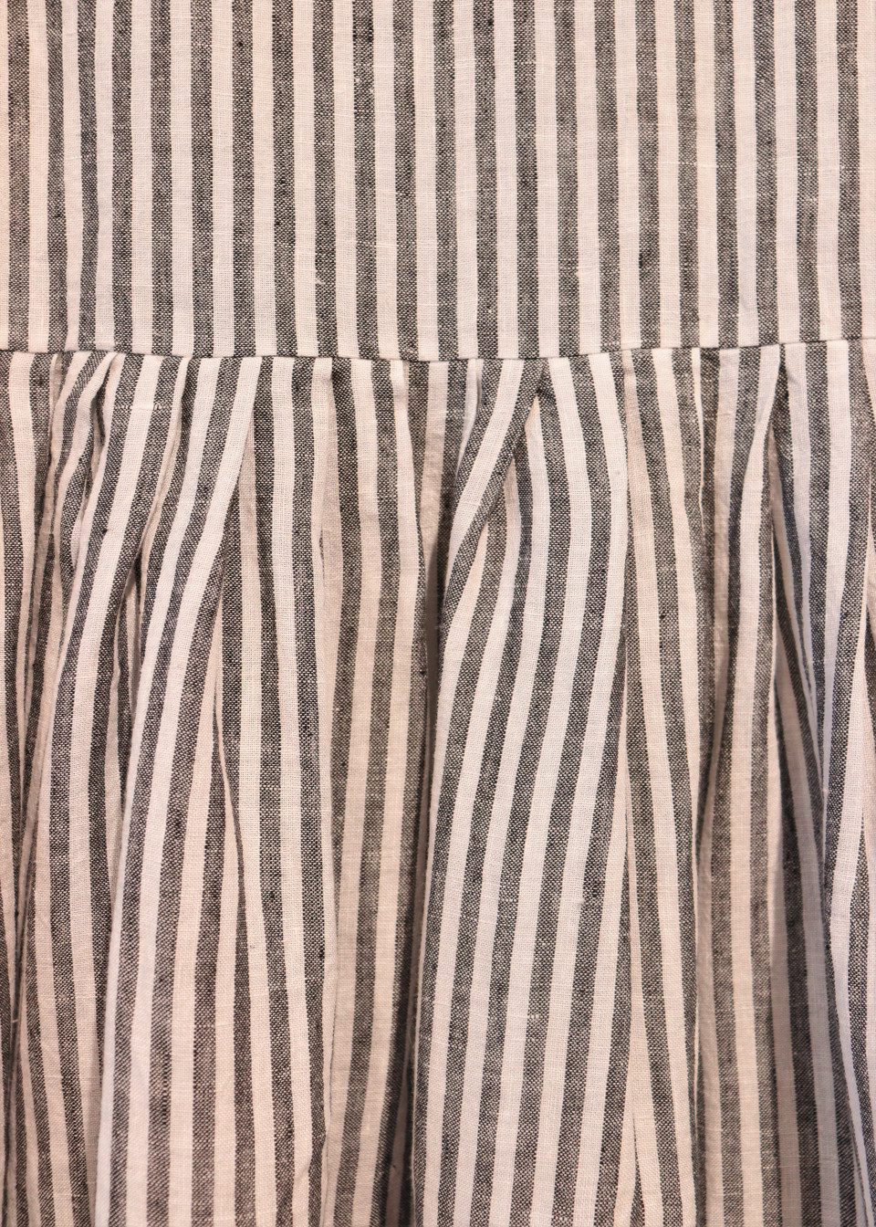 Uniform pleated dress, sleeveless, light stripes linen