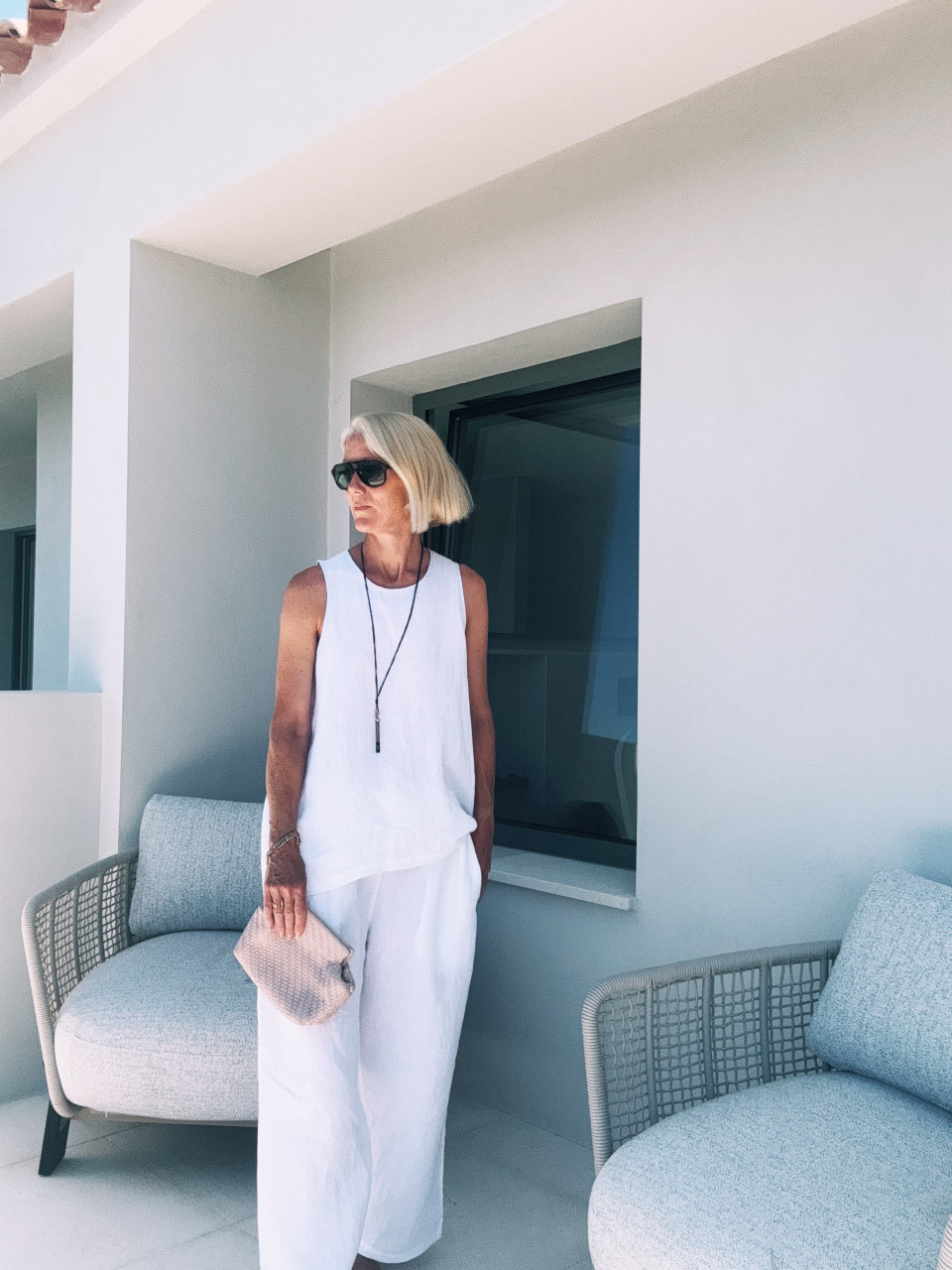 Sleeveless blouse, round neck, white linen Sleeveless blouse, round neck, white linen
